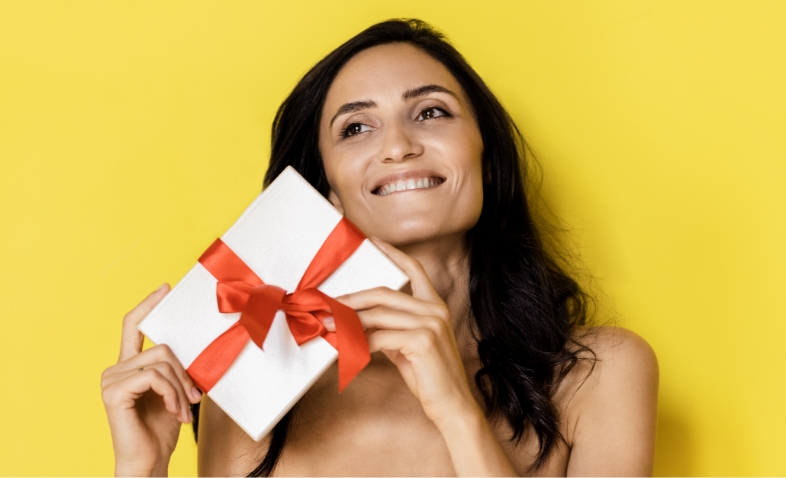 Increase your sales by selling gift vouchers 2 woman holding white present box with red gift ribb 2025 01 09 07 54 51 utc